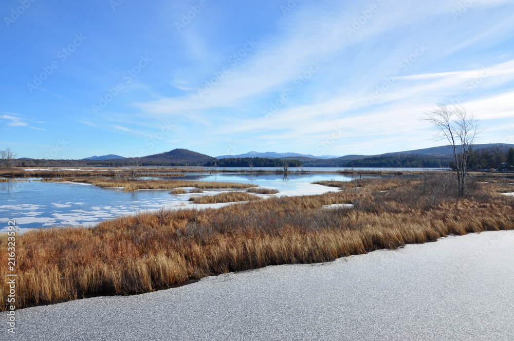 Tupper Lake in winter with snow in town of Tupper Lake, Adrondack Mountains, New York, USA. Tupper Lake in winter with snow in town of Tupper Lake, Adrondack Mountains, New York, USA.