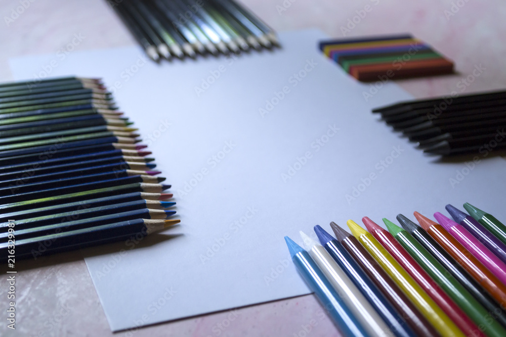 Fototapeta premium The set of pencils and white paper on the table.