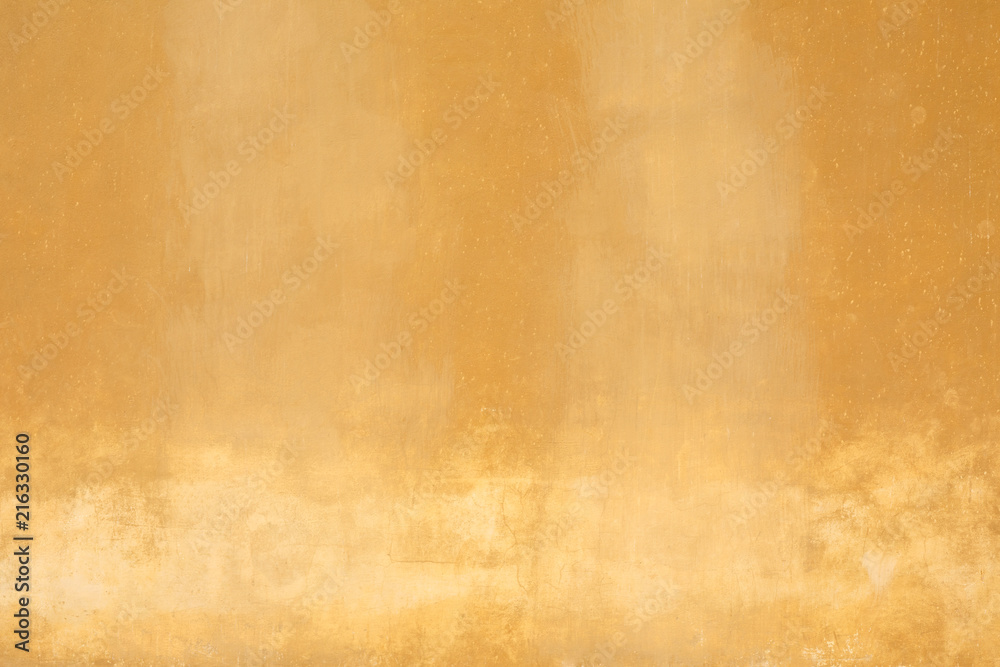 Yellow old faded wall texture background