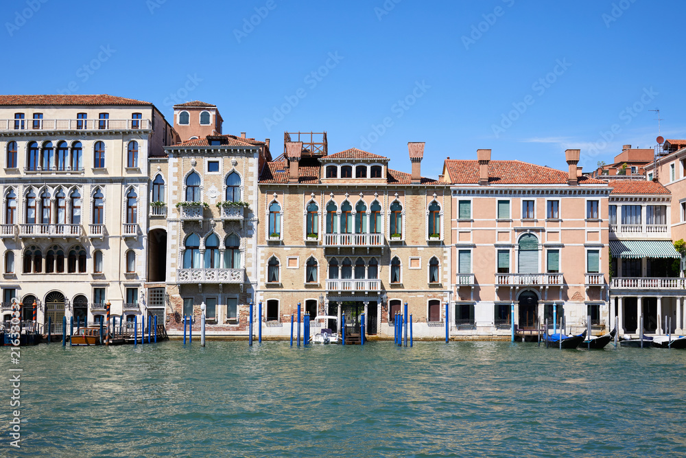 Venice ancient buildings facades and the grand canal in a sunny day in Italy
