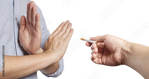 Crossed hands refusing a cigarette offer, isolated on white background
