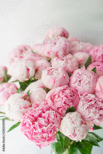 Fototapeta Naklejka Na Ścianę i Meble -  pink peonies . Floral composition, daylight. Wallpaper. Lovely flowers in glass vase. Beautiful bouquet