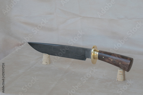 Slika na platnu A damascus bowie knife on display