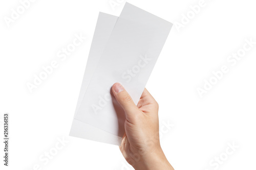 Male hand holding two blank sheets of paper (tickets, flyers, invitations, coupons, money, etc.), isolated on white background photo
