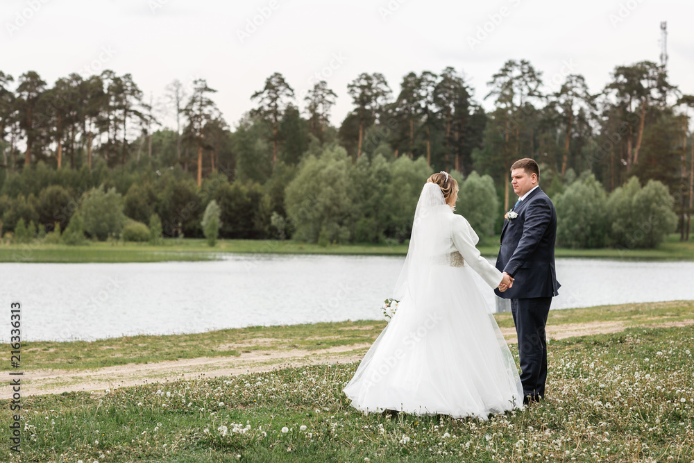 Wedding day. Young couple on the nature