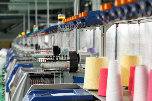 Textile industry with knitting machines photo