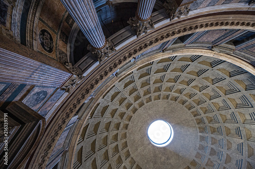 Photography Looking up at the shaft of light coming through the oculus in the Pantheo, Rome