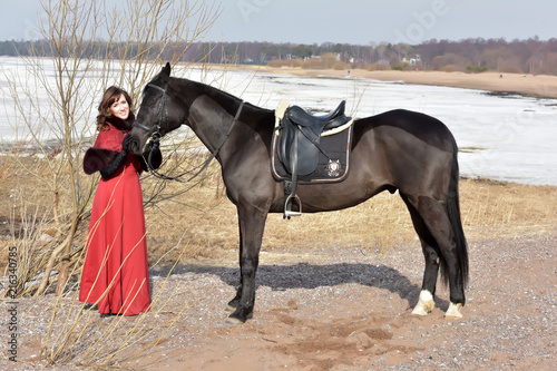 woman in vintage suit with horse