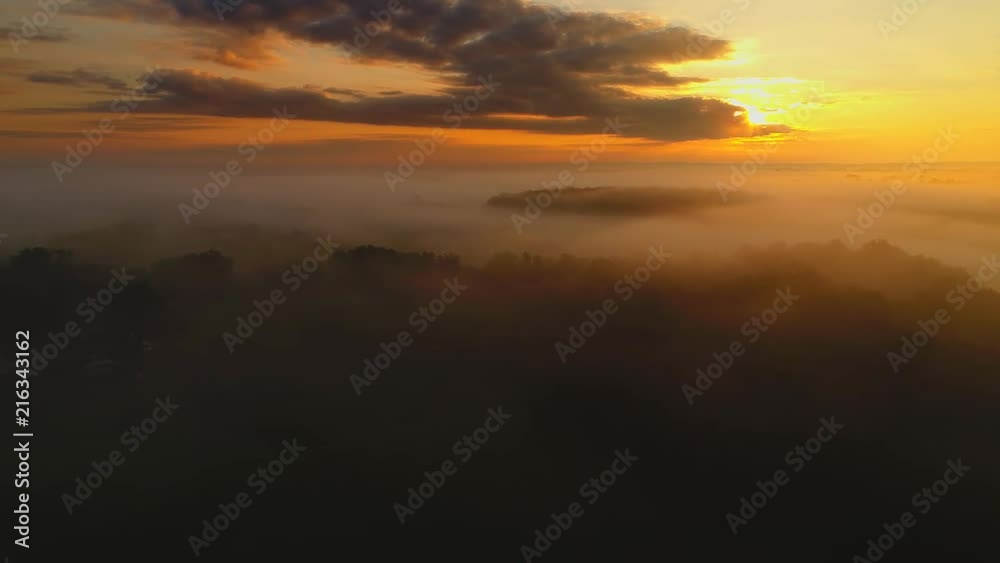 Ethereal fog shrouded rural landscape at sunrise with surreal beauty, aerial view.
Ethereal fog shrouded rural landscape at sunrise with surreal beauty, aerial view.