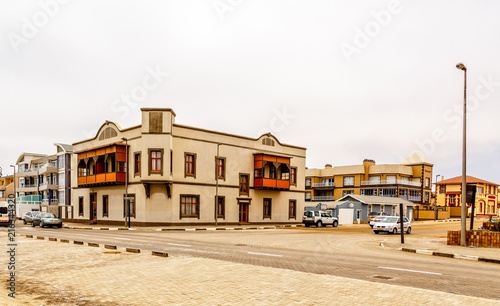 Old German colonial buildings and crossroad with some traffic, S