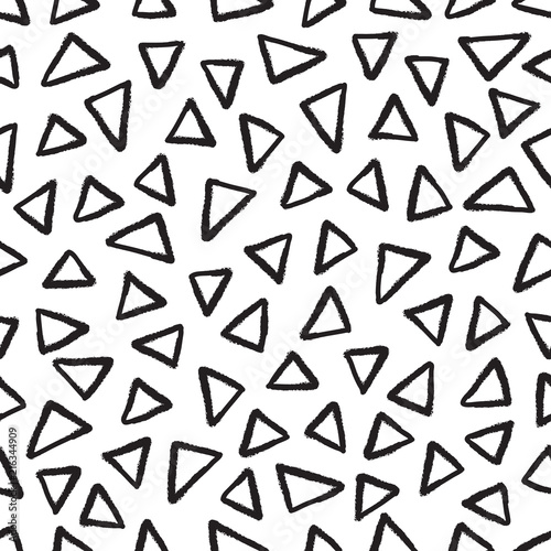Abstract seamless black and white pattern of hand drawn doodle triangle elements. Scandinavian design style. Vector illustration for textile  backgrounds etc