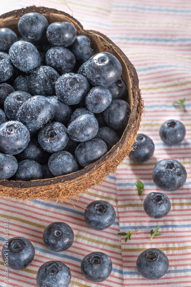 Fresh ripe wild blueberries in bowl. Wild blueberry in top view flat lay with copy space for background or wallpaper. Blueberry is antioxidant food and vitamin C Fresh ripe wild blueberries in bowl. Wild blueberry in top view flat lay with copy space for background or wallpaper. Blueberry is antioxidant food and vitamin C