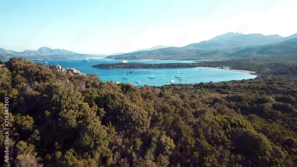 View from above, aerial view of a transparent and turquoise sea with some boats and yachts. Emerald Coast, Sardinia, Italy. View from above, aerial view of a transparent and turquoise sea with some boats and yachts. Emerald Coast, Sardinia, Italy.