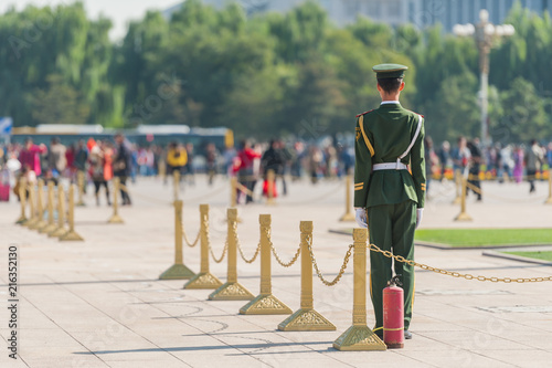 Soldier stands guard near the entrance to Forbidden City in Tiananmen Square.