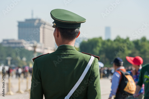 Soldier stands guard near the entrance to Forbidden City in Tiananmen Square.