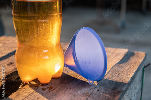 Hand is pouring the used oil