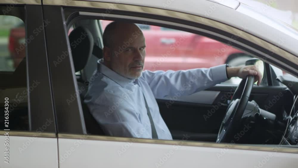 Man pulls up to taxi young woman to destination as she used Uber app to get a ride. Man pulls up to taxi young woman to destination as she used Uber app to get a ride.
