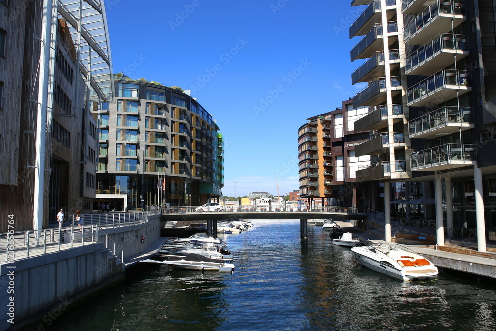 Oslo, Norway - July 24, 2018: View to Scandinavian architecture in Aker Brygge district. Aker brygge is popular area for entertainment along the inner harbour of Oslo Fjord.