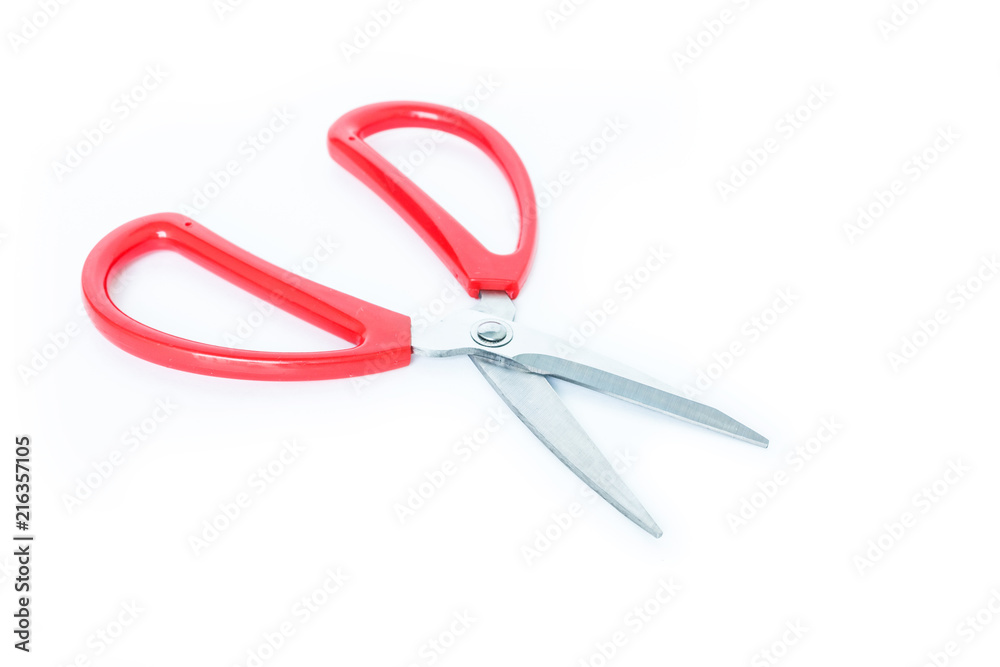 red scissors cutting on white background red scissors cutting on white background
