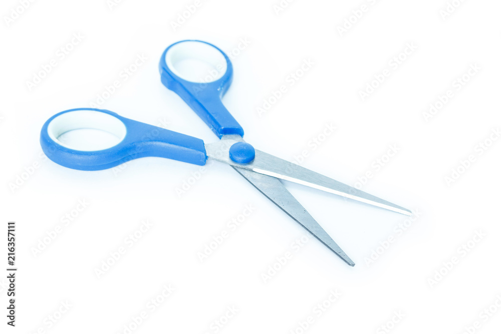 blue scissors cutting on white background blue scissors cutting on white background
