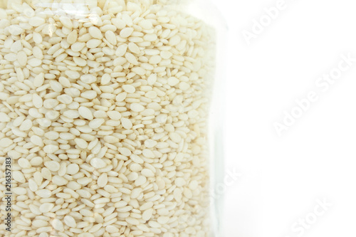 white sesame seed in jar on white background