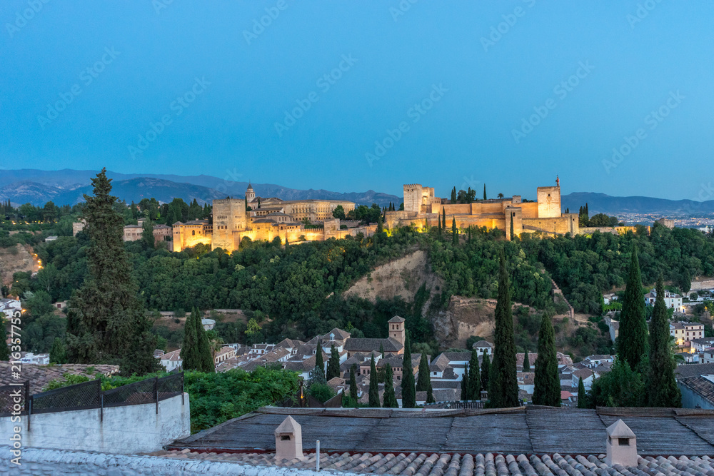 Fototapeta premium The magnificient Alhambra of Granada, Spain. Alhambra fortress at sunset viewed from Mirador de San Nicolas.