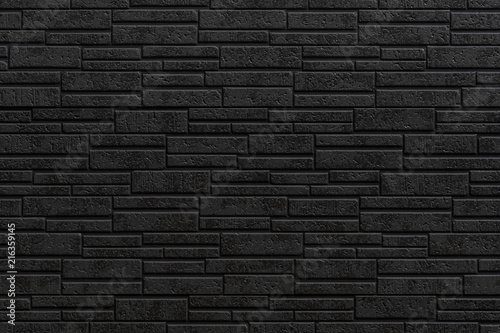 Black modern stone tile wall pattern and seamless background
