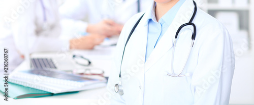Wallpaper Mural Unknown female doctor with medical staff  at hospital. Teamwork in medicine Torontodigital.ca