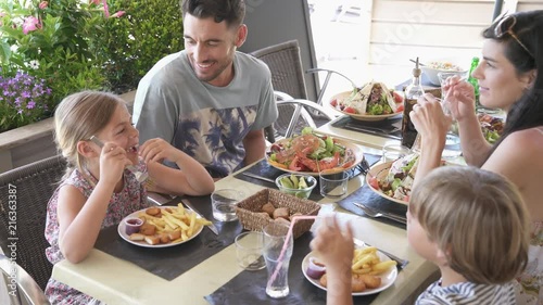 Family on vacation having lunch at hotel restaurant
