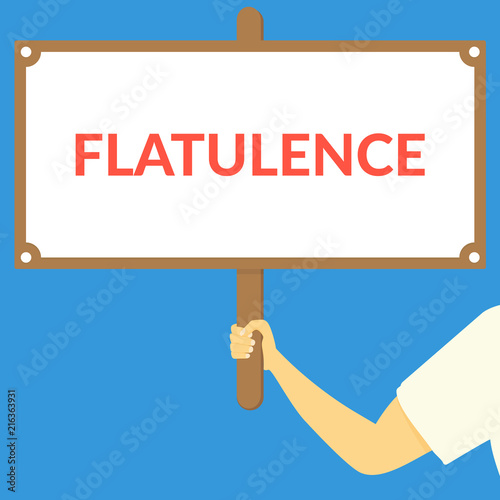 FLATULENCE. Hand holding wooden sign