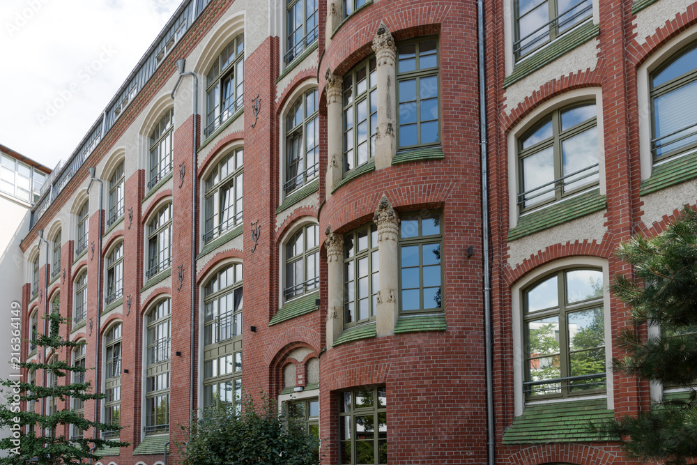 Facade of a modernized residential house with red bricks