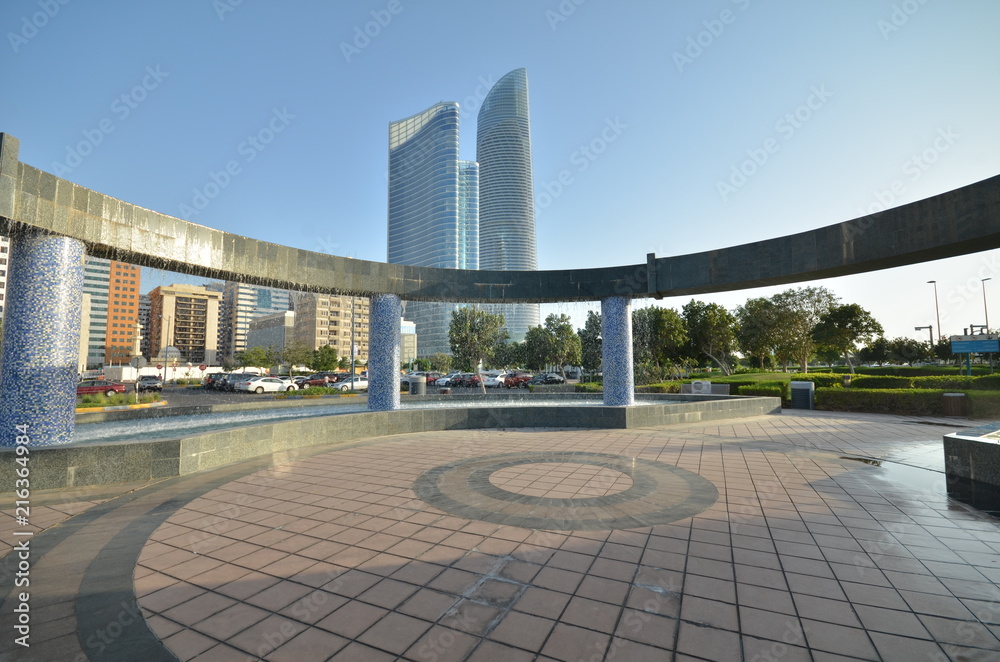 The fountain on the background of skyscrapers in Abu Dhabi, United Arab Emirates