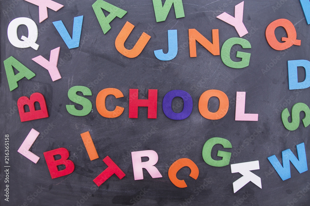 Obraz premium letters and pencils on blackboard, back to school concept