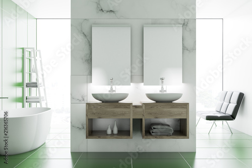 Double sink in marble and green bathroom