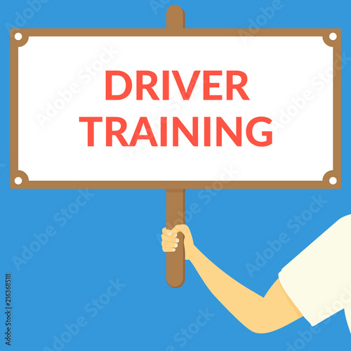 DRIVER TRAINING. Hand holding wooden sign