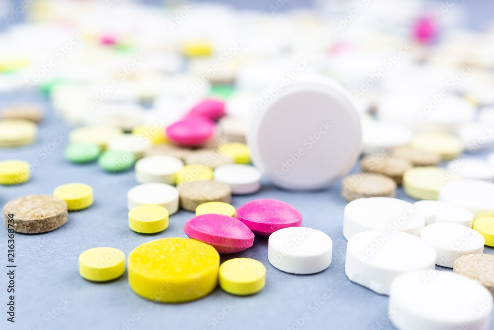 pills on a blue background pills on a blue background