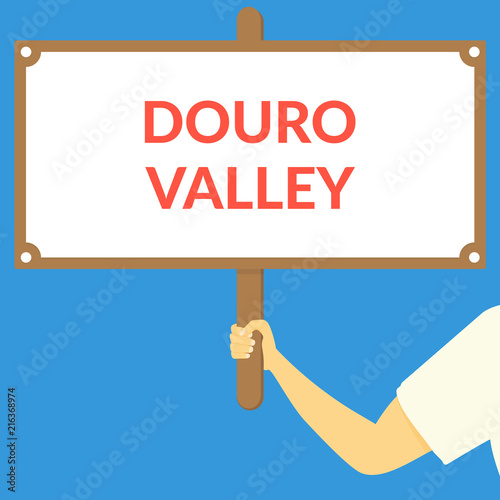 DOURO VALLEY. Hand holding wooden sign