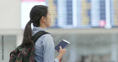 Woman holding passport in the airport
