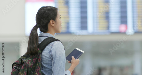 Photography Woman holding passport in the airport