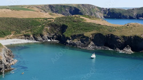 Looking down towards a white moter cruiser moored off Solva Pembrokeshire photo