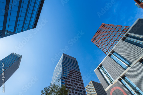 Modern office building against blue sky.