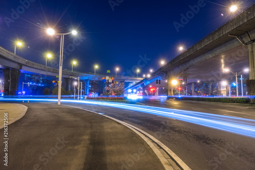 Vehicle light trails in city at night.