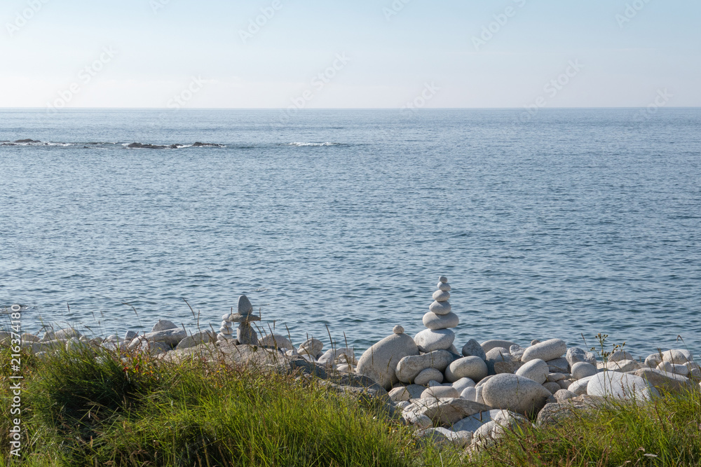 Pebble tower by the sea, Brittany, France Pebble tower by the sea, Brittany, France