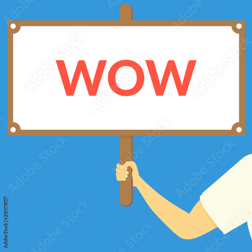 WOW. Hand holding wooden sign