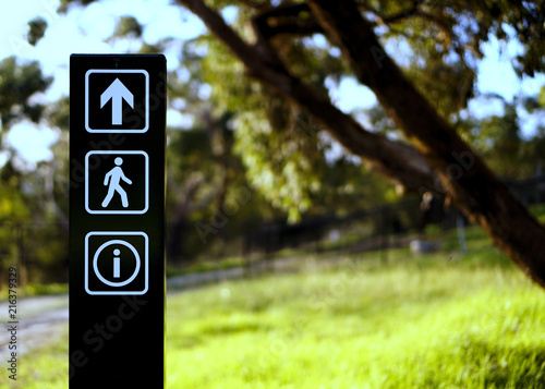 arrow walking information sign at park