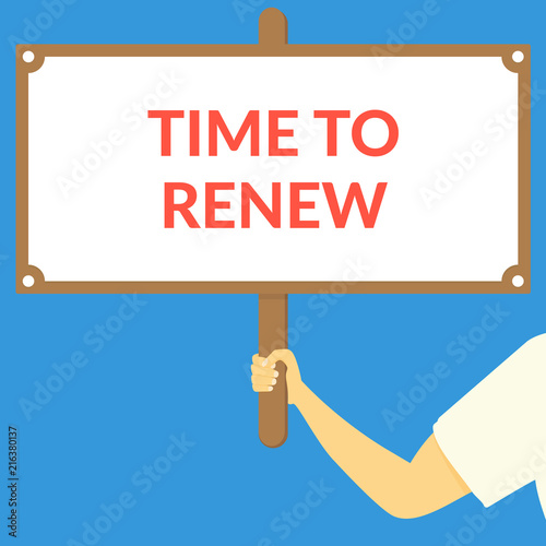 TIME TO RENEW. Hand holding wooden sign