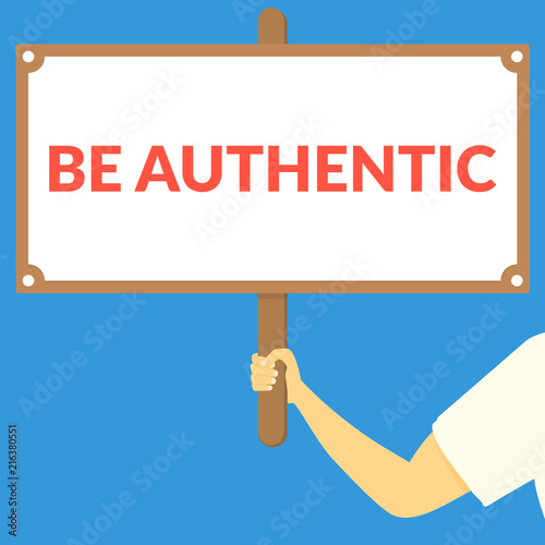 BE AUTHENTIC. Hand holding wooden sign