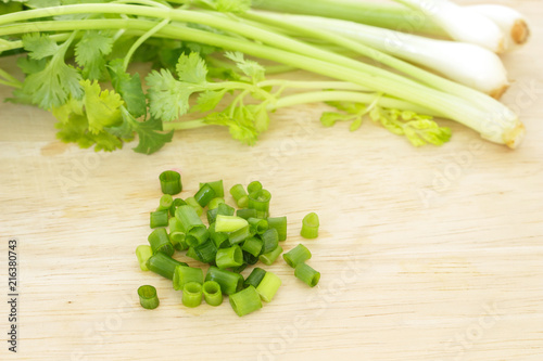 green onion and parsley vegetable ingredient food on cutting board