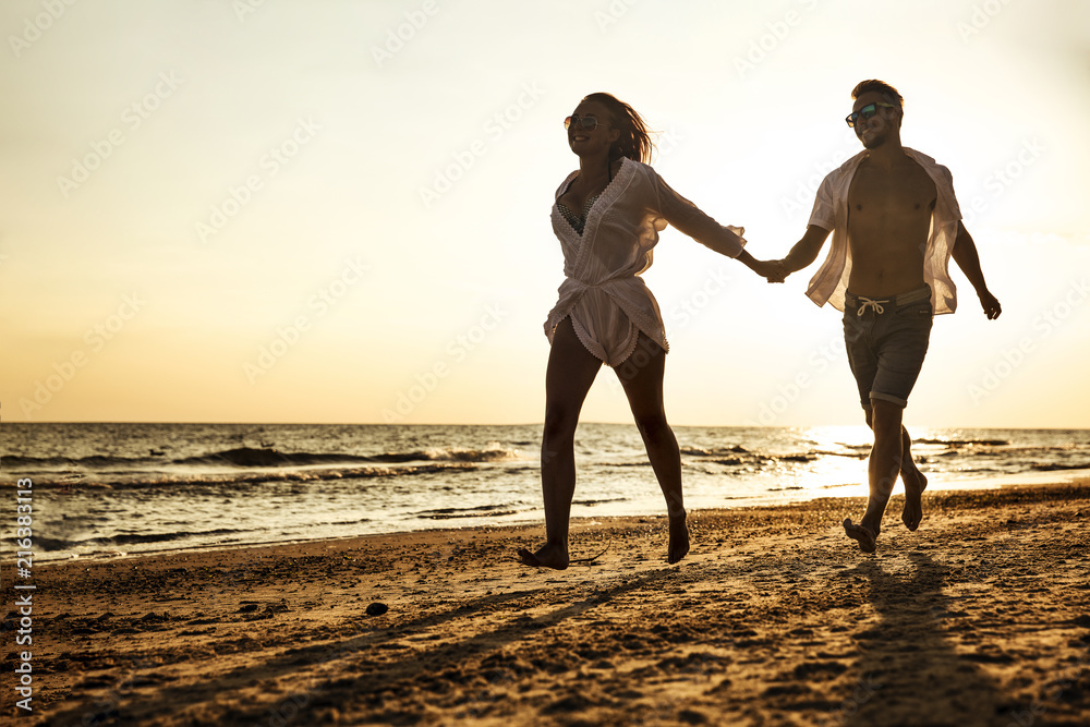 Fototapeta premium summer time on beach and two lovers