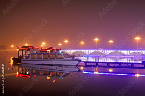 night landscape, bridge and cruise ship on the river
